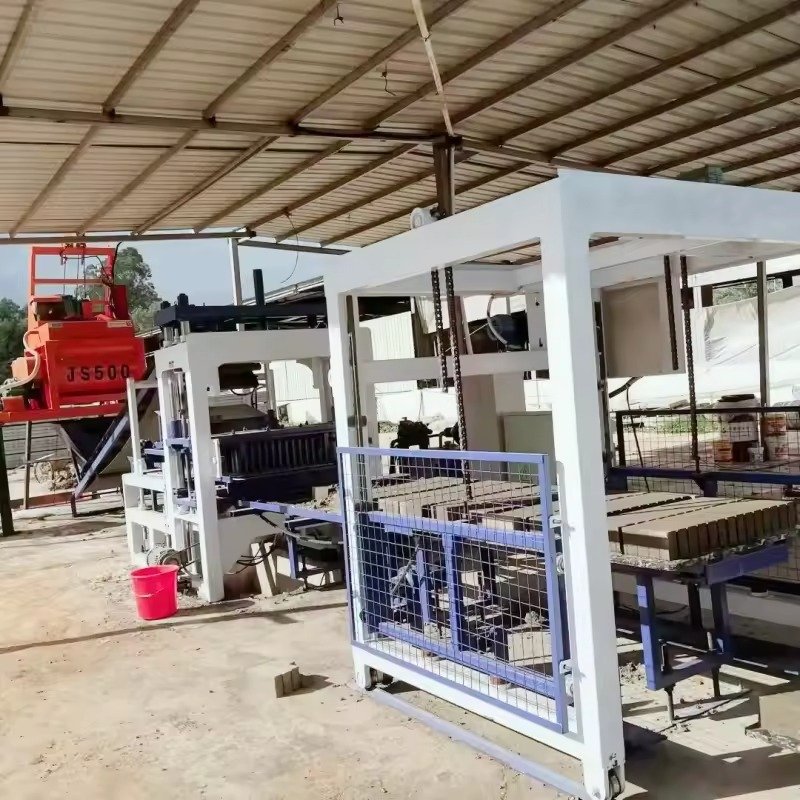 Modern paving brick making machine producing interlocking pavers in industrial facility
