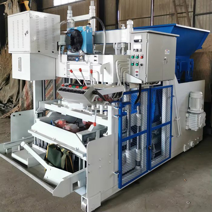 Modern paving brick making machine producing interlocking pavers in industrial facility